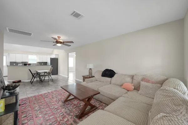 a living room with furniture and a window