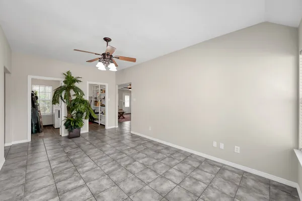 a kitchen with a stove sink and cabinets