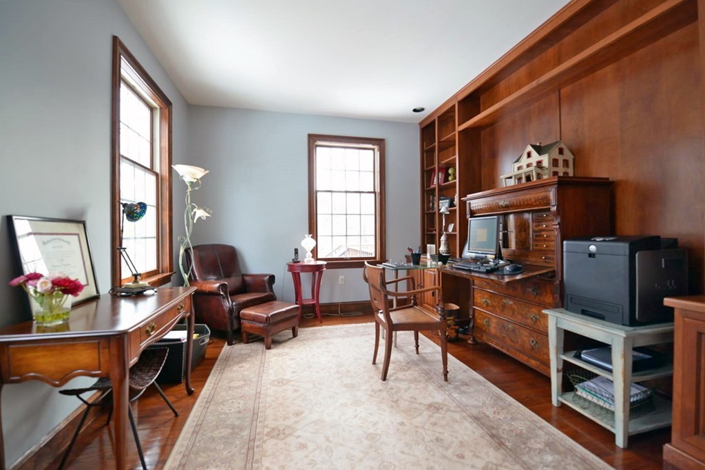 73 Longfellow Road Wellesley, MA 02481 - Photo 10 of 11 a living room with furniture a flat screen tv and a window