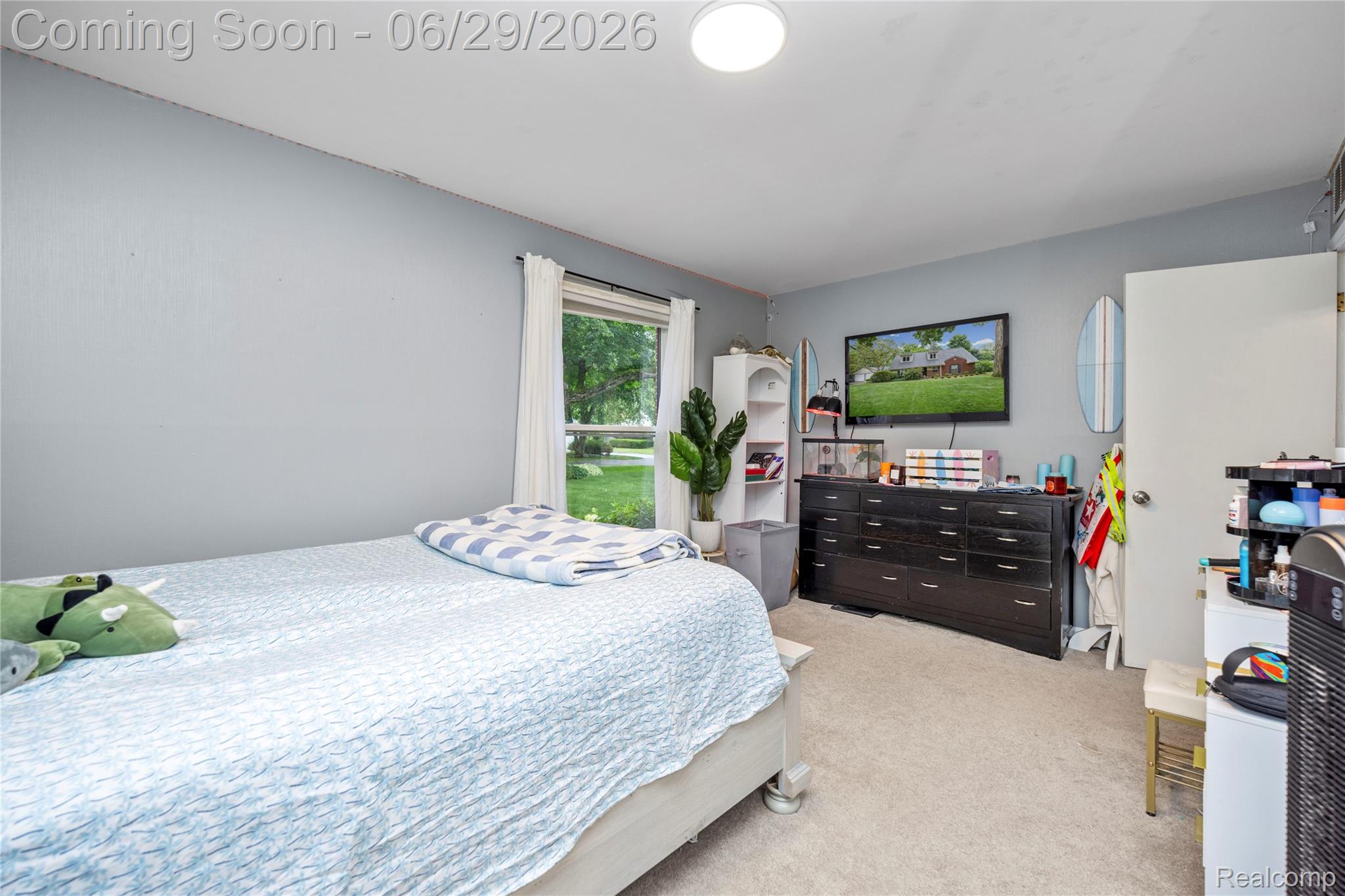6085 Worlington Road Bloomfield Hills, MI 48301 - Photo 42 of 75 Light gray walls and light-toned carpeting define this room, featuring a window with white drapes