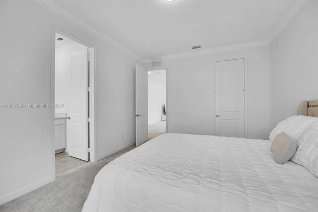 a bedroom with a bed and a closet