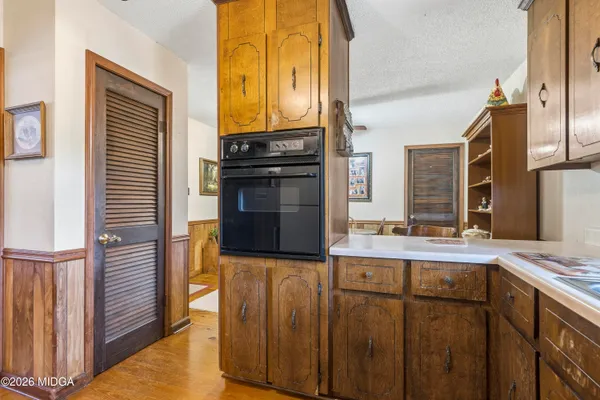 a kitchen with stainless steel appliances granite countertop a stove and a refrigerator