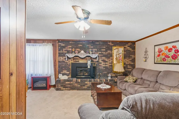 a living room with furniture and a fireplace