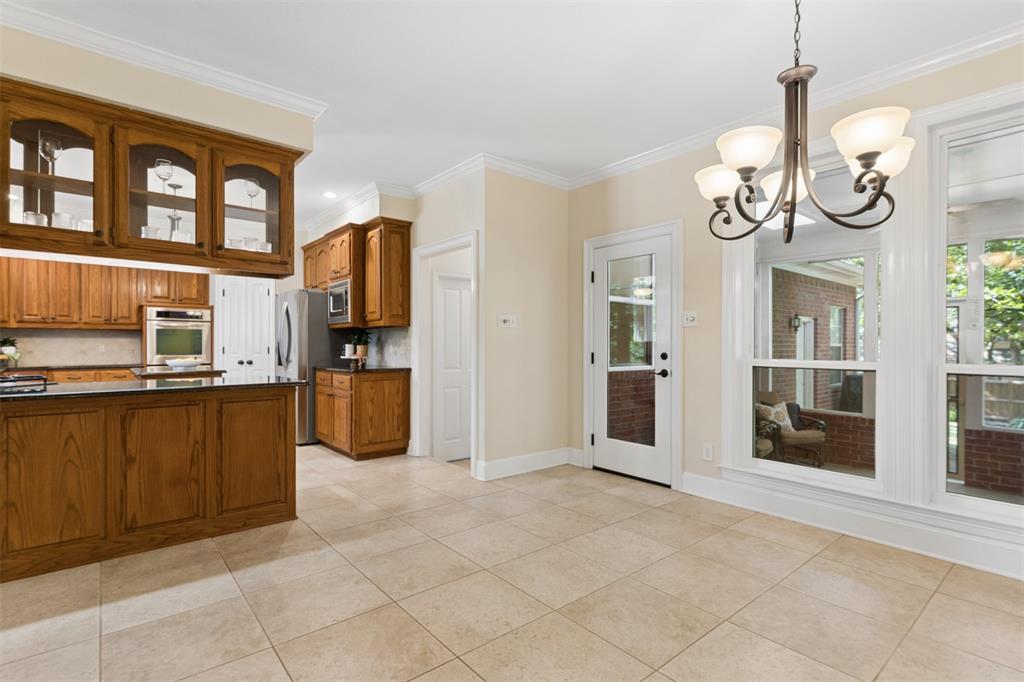 41 Oak Forrest Circle Denton, TX 76210 - Photo 10 of 29 Breakfast nook opens to back screened in porch