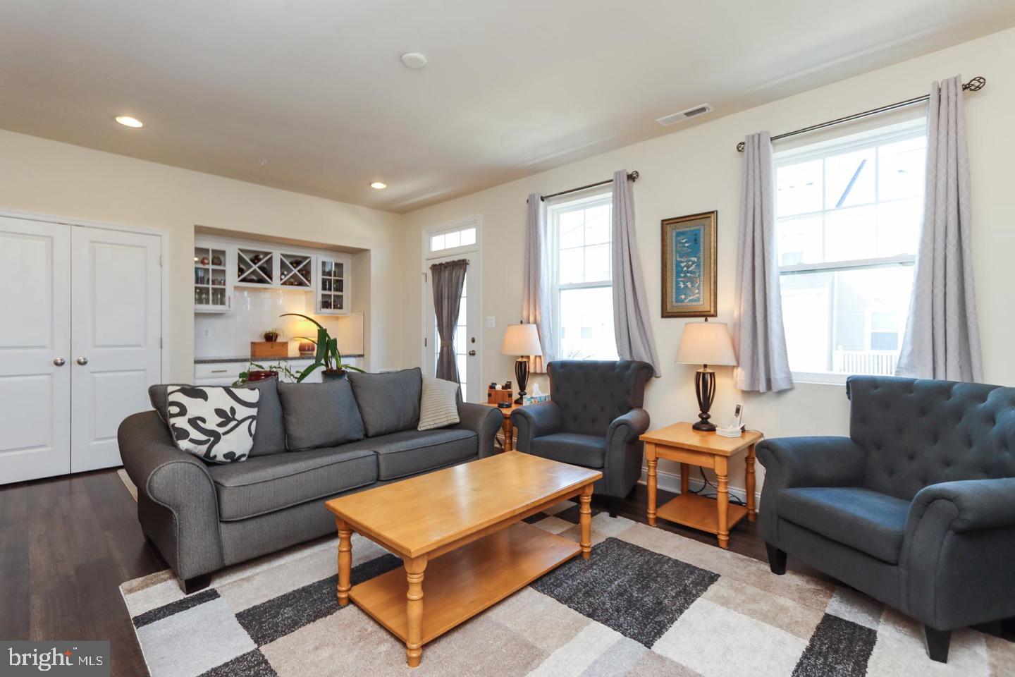 7146 Proclamation Place Frederick, MD 21703 - Photo 14 of 26 a living room with furniture a rug and a window