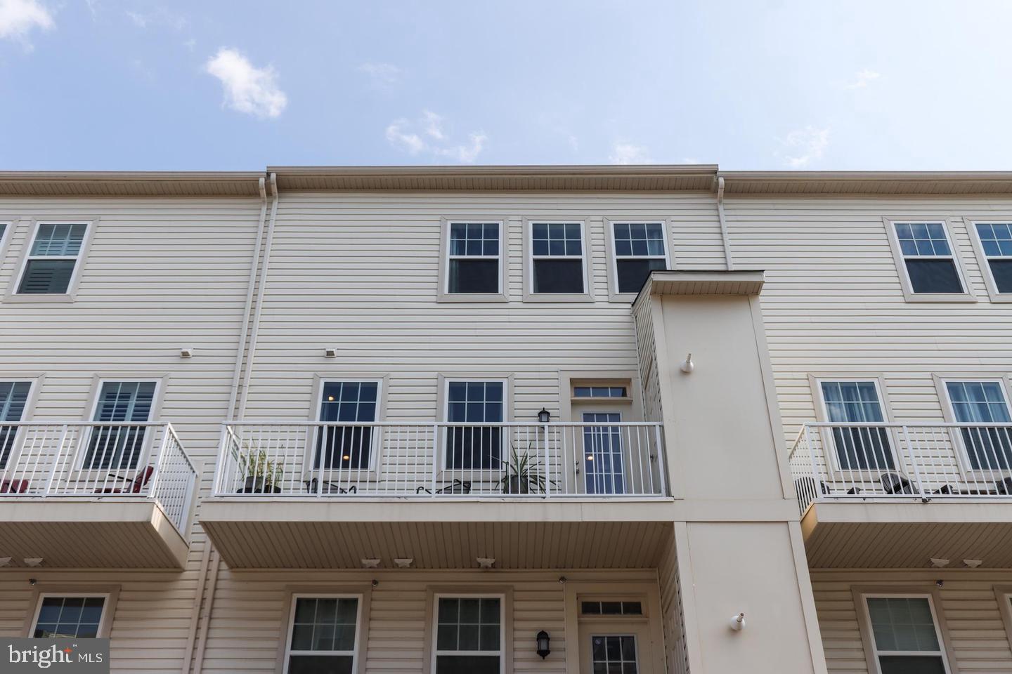 7146 Proclamation Place Frederick, MD 21703 - Photo 16 of 26 a tall building with a outdoor space