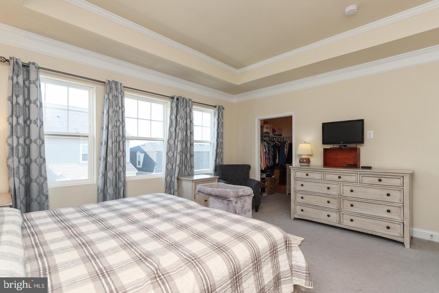 7146 Proclamation Place Frederick, MD 21703 - Photo 18 of 26 a bedroom with a bed and furniture