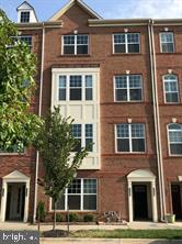 7146 Proclamation Place Frederick, MD 21703 - Photo 2 of 26 a front view of a building with a tree