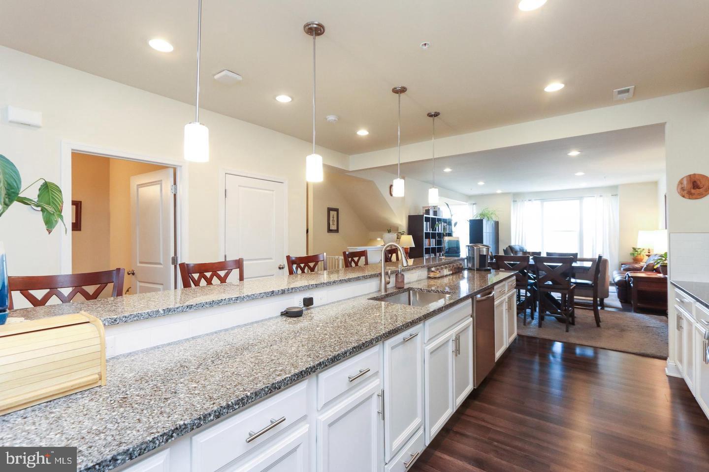 7146 Proclamation Place Frederick, MD 21703 - Photo 6 of 26 a large kitchen with lots of counter space a sink and cabinets