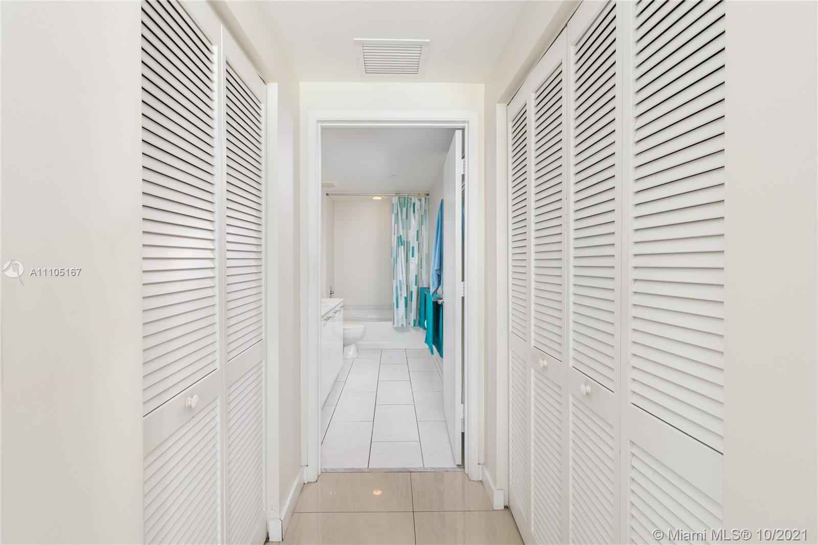 951 Brickell Avenue, Unit 2706 Miami, FL 33131 - Photo 17 of 35 a view of a bathroom from the hallway
