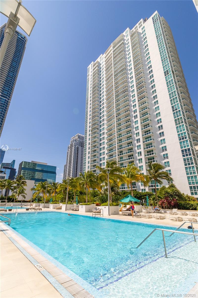 951 Brickell Avenue, Unit 2706 Miami, FL 33131 - Photo 25 of 35 a front view of a residential apartment building with a yard