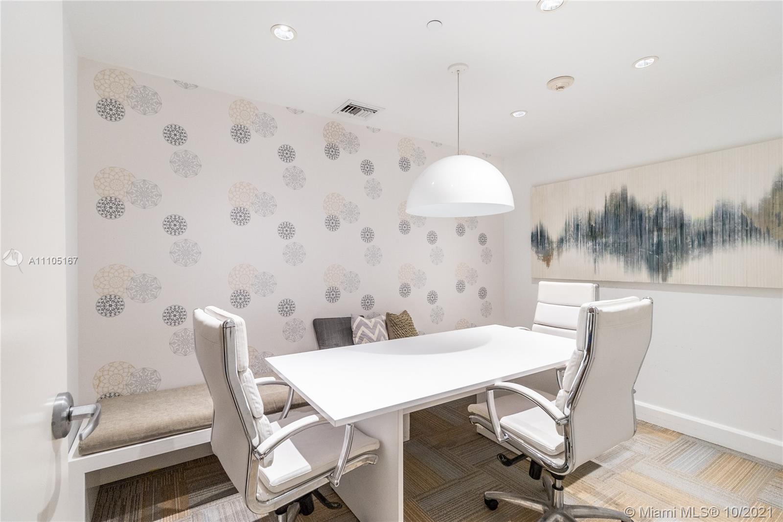 951 Brickell Avenue, Unit 2706 Miami, FL 33131 - Photo 29 of 35 a view of a dining room with furniture and wooden floor