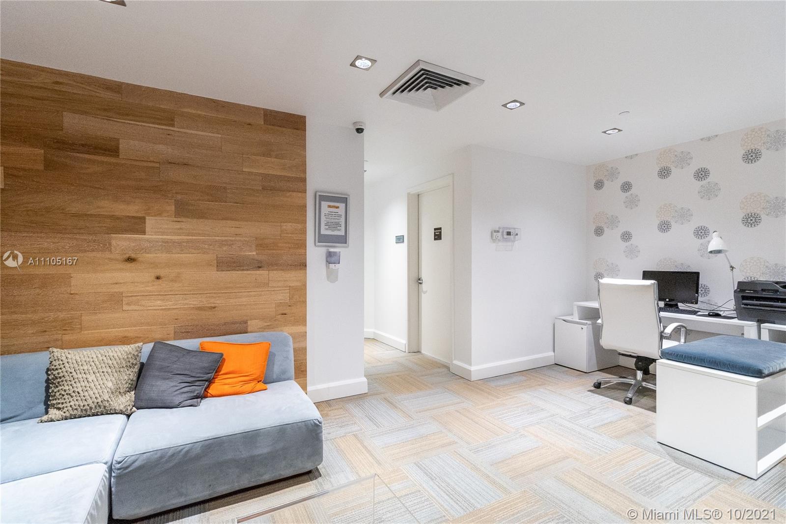 951 Brickell Avenue, Unit 2706 Miami, FL 33131 - Photo 30 of 35 a living room with furniture and a couch