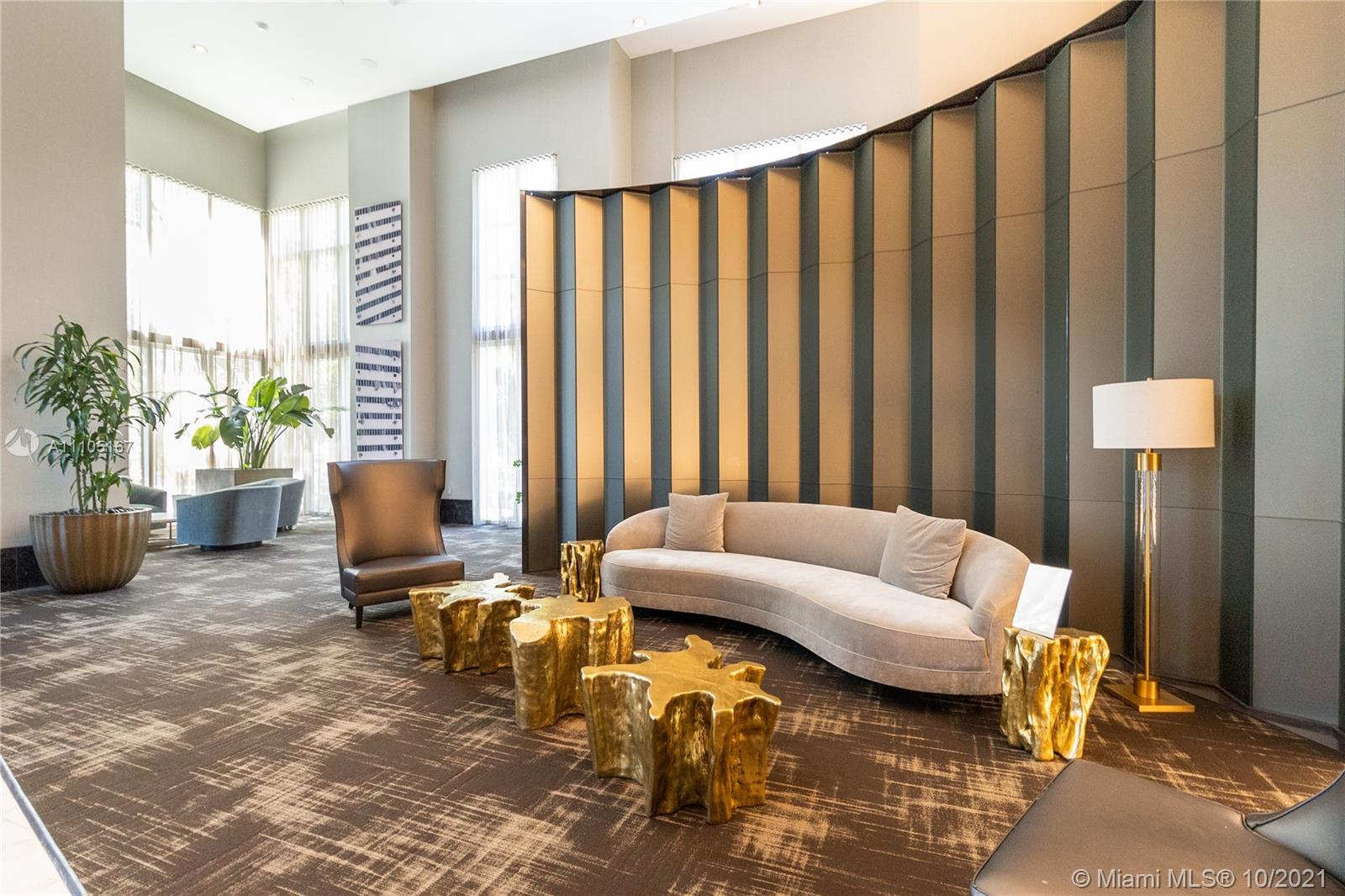 951 Brickell Avenue, Unit 2706 Miami, FL 33131 - Photo 32 of 35 a living room with furniture and a large window