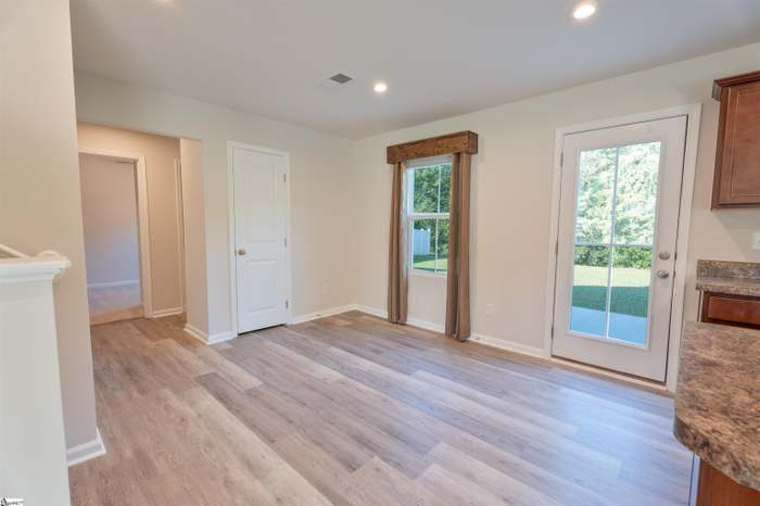 156 Queens Mill Court Pendleton, SC 29670 - Photo 7 of 18 This bright, open-concept room features durable flooring and convenient access to the outdoors.