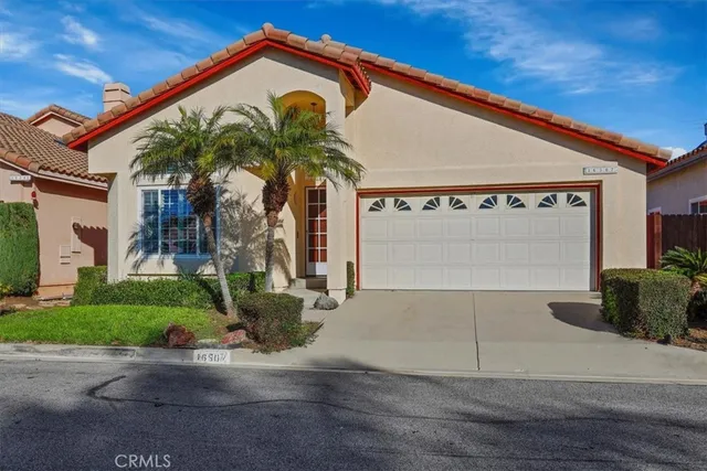 a view of a house with a street