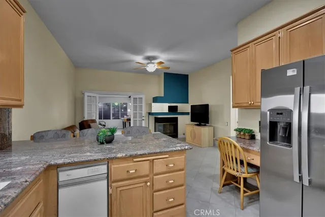 a kitchen with granite countertop cabinets and stainless steel appliances
