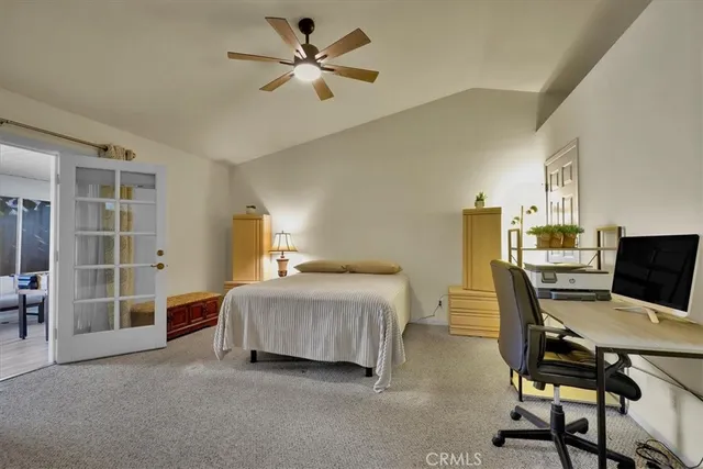 a bedroom with a bed and a desk