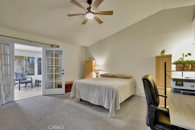 a bedroom with a bed chair and a window