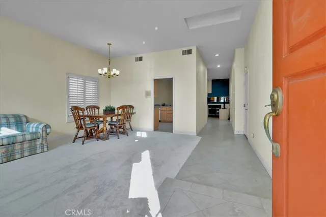 a view of a livingroom with furniture and a ceiling fan