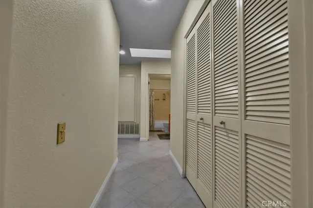 a view of a bathroom from a hallway
