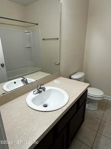 a bathroom with a sink and a toilet
