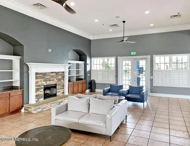 a living room with fireplace furniture and a fireplace