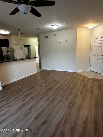 a view of a big room with wooden floor