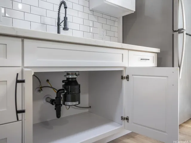a bathroom with a sink a mirror and a shower