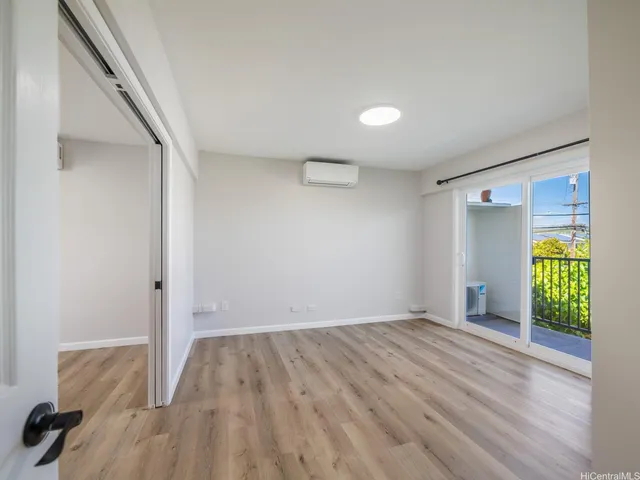 a view of a hallway with washer and dryer