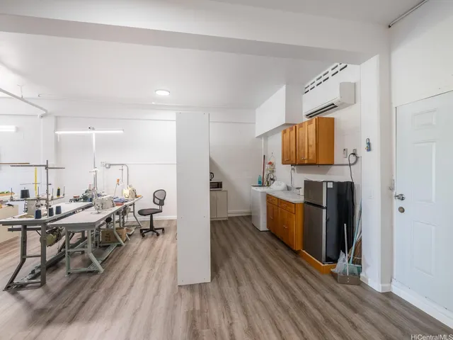 a large kitchen with sink and window