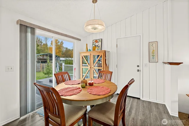 a view of a dining room with furniture window and wooden floor