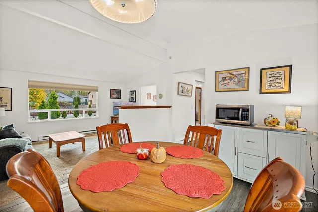 a bedroom with furniture and a wooden floor