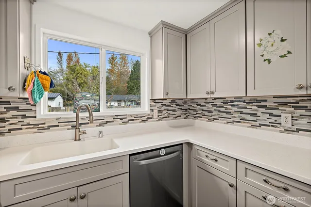 a kitchen with a sink and a window