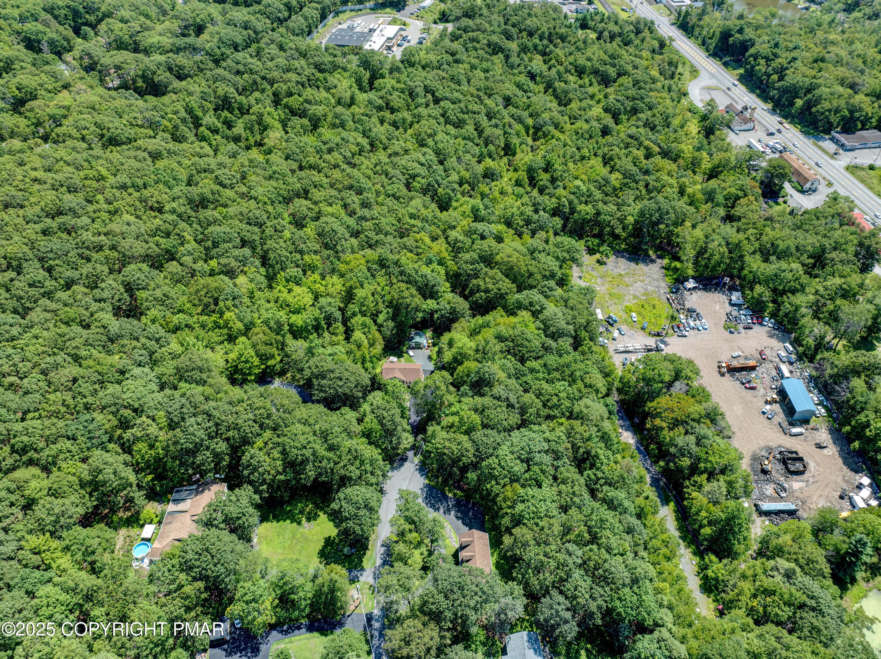 85 Birch Road Swiftwater, PA 18370 - Photo 6 of 7 an aerial view of a house with a lush green space