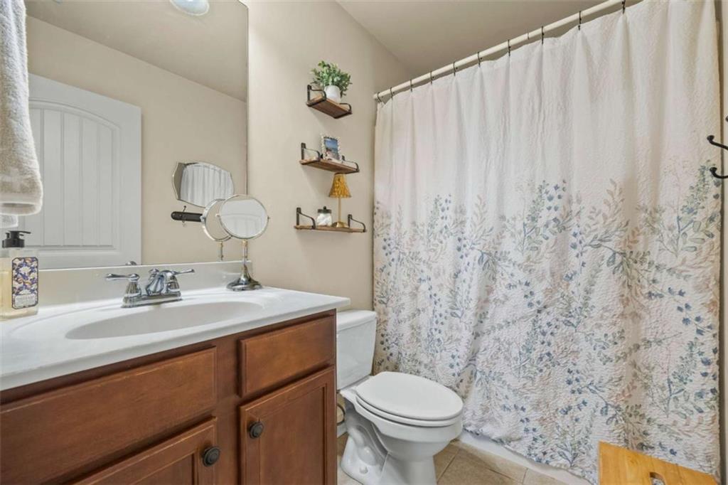 42 Pintail Lane Jefferson, GA 30549 - Photo 17 of 42 a bathroom with a granite countertop sink and a mirror