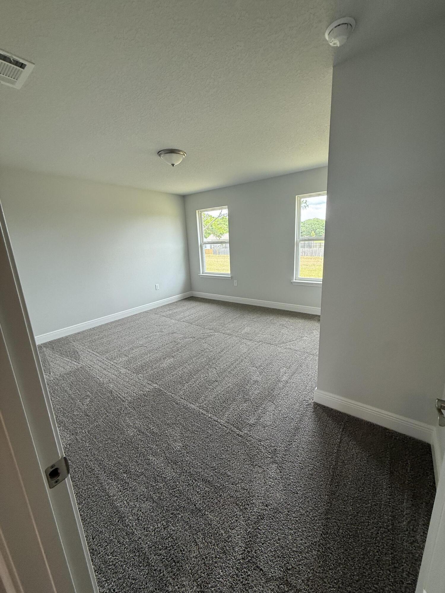 6004 Crocket Cove Crestview, FL 32539 - Photo 10 of 24 an empty room with windows