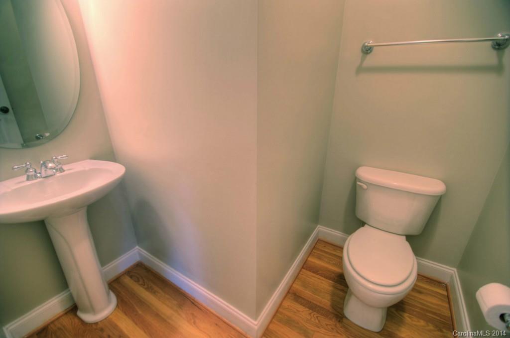 326 Third Baxter Street Fort Mill, SC 29708 - Photo 7 of 15 a white toilet sitting next to a bathroom sink