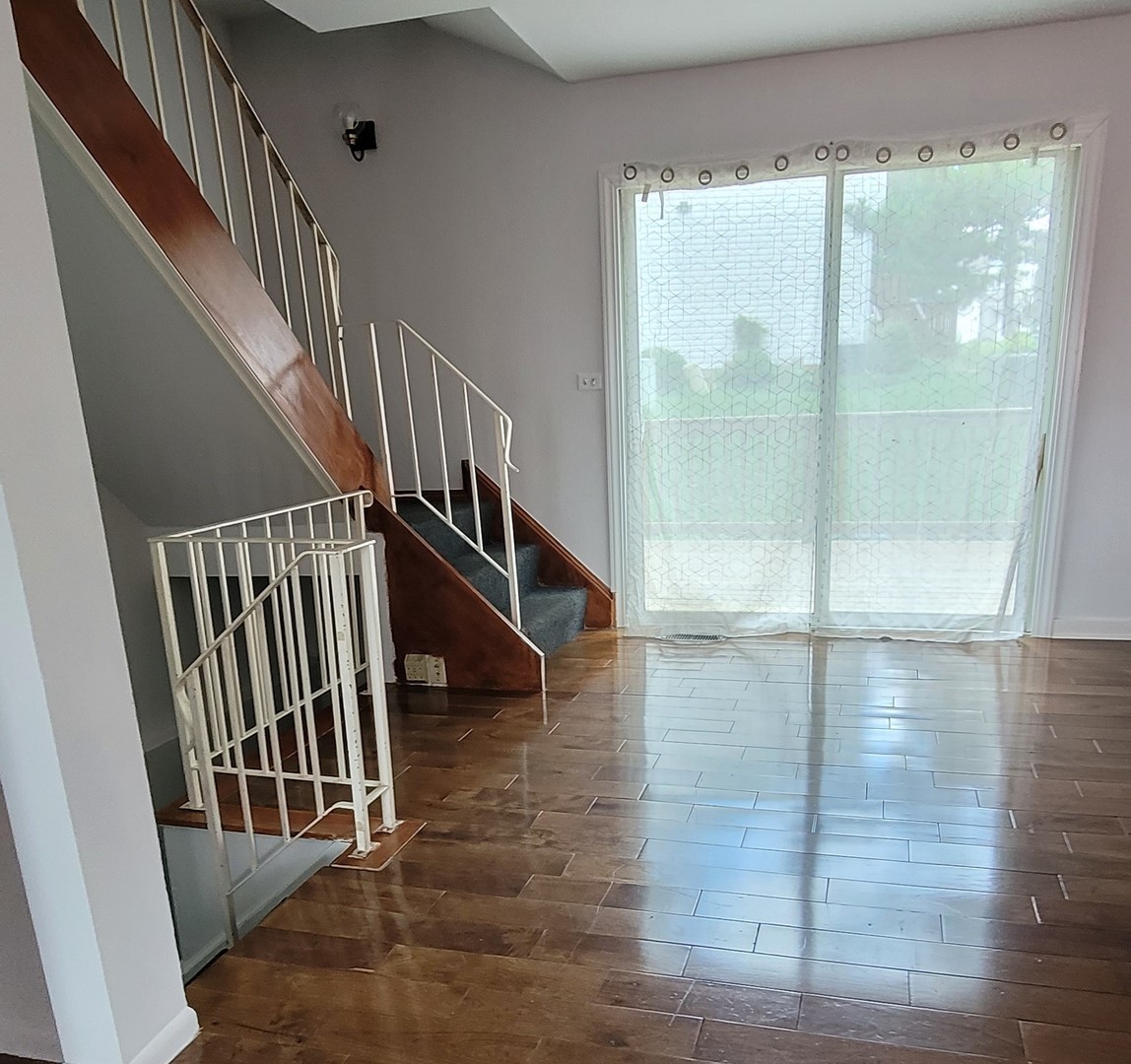249 Peppertree Lane Aurora, IL 60504 - Photo 7 of 10 a view of entryway with wooden floor
