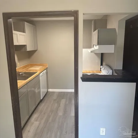 a hallway with washer and dryer