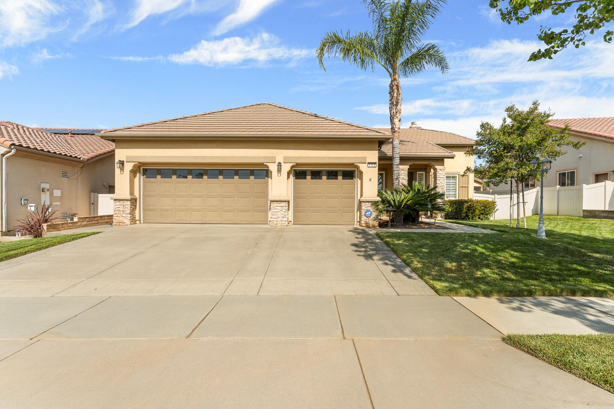 744 Copper Circle Beaumont, CA 92223 - Photo 1 of 44 a front view of a house with a yard and garage