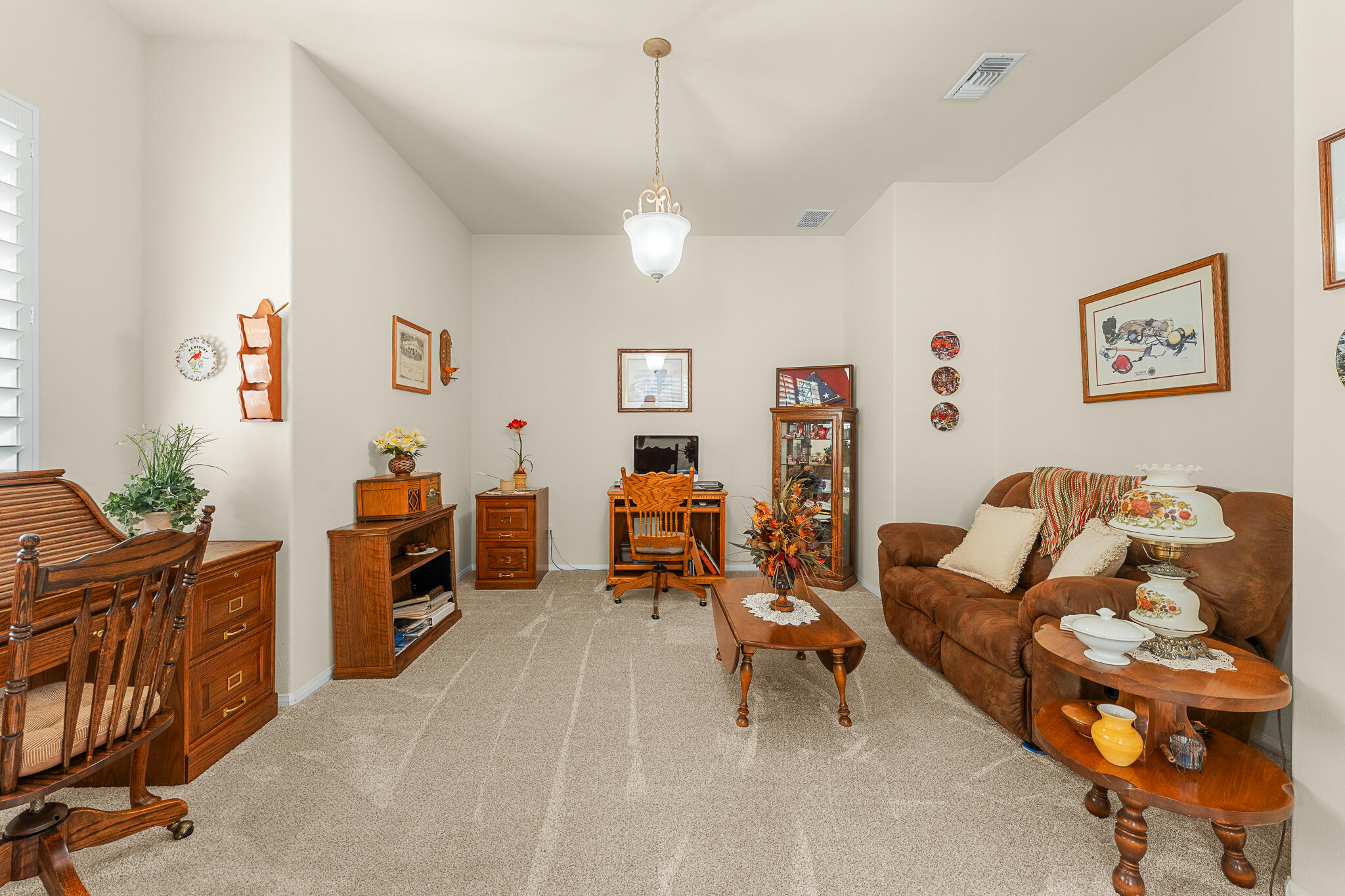 744 Copper Circle Beaumont, CA 92223 - Photo 11 of 44 a living room with furniture and wooden floor