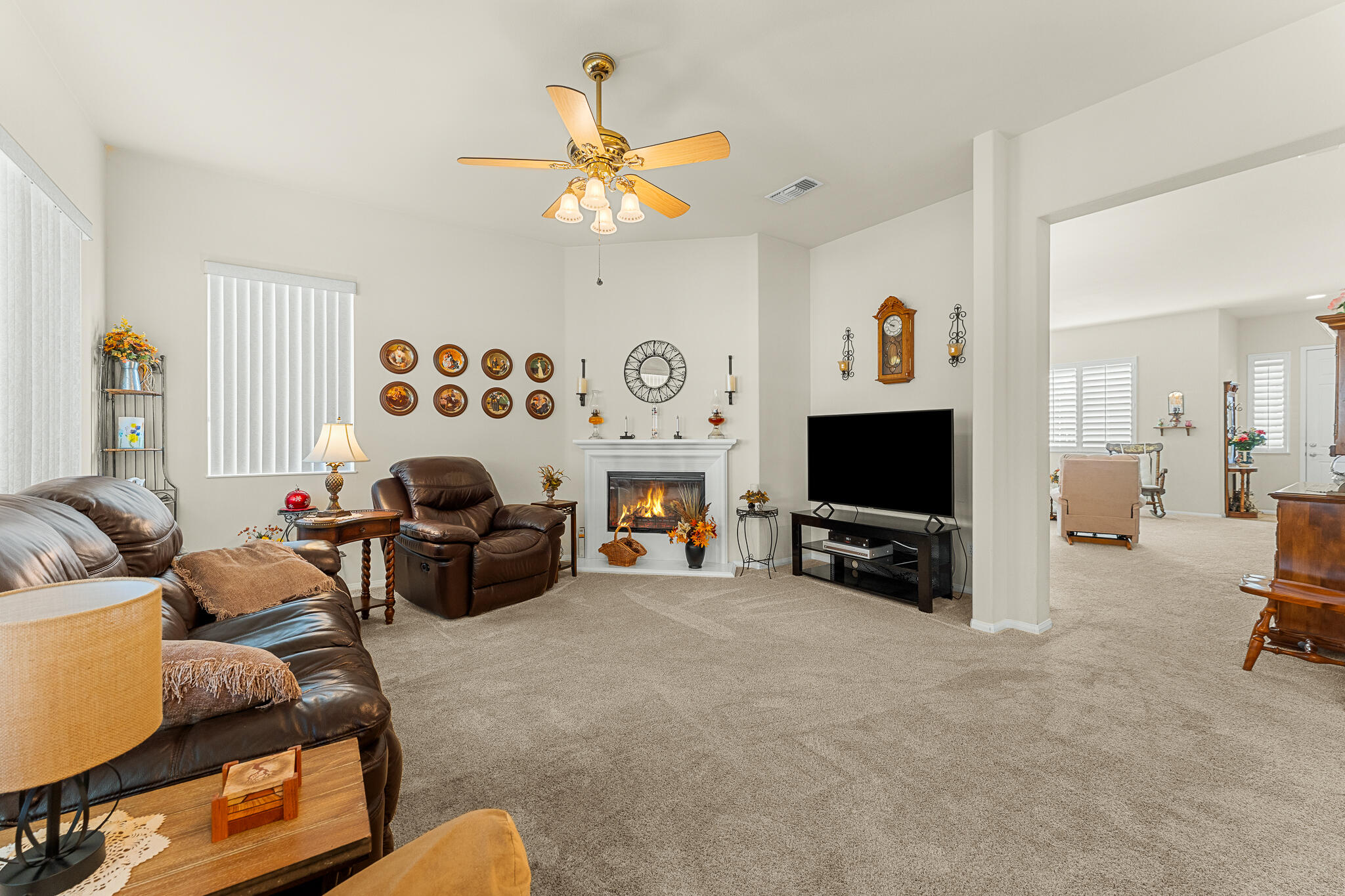 744 Copper Circle Beaumont, CA 92223 - Photo 15 of 44 a living room with furniture and a flat screen tv