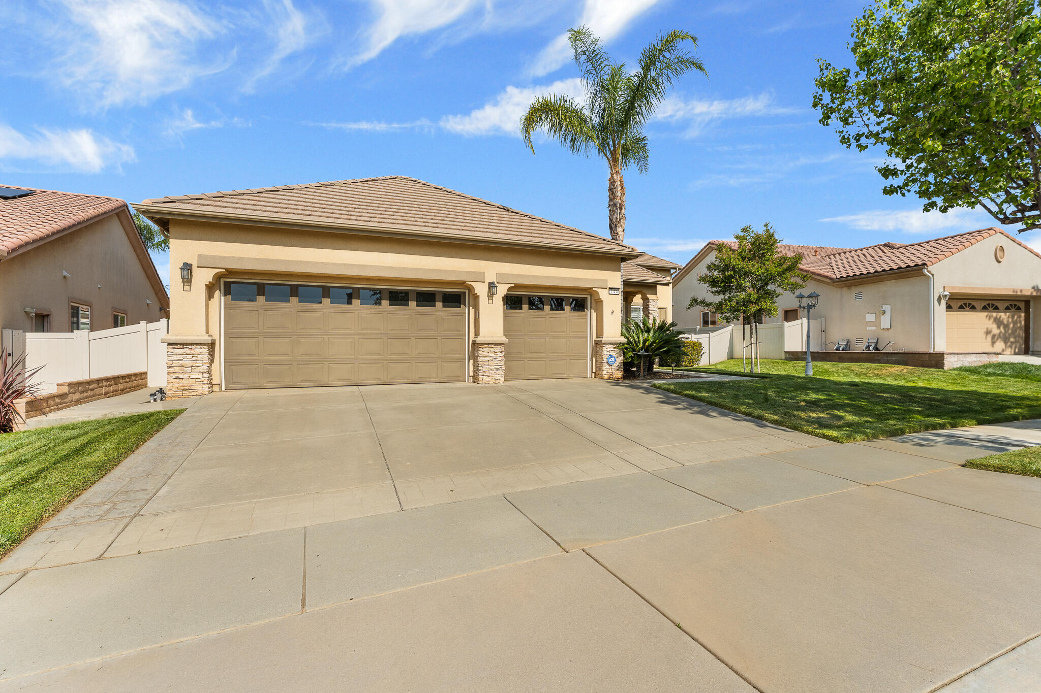 744 Copper Circle Beaumont, CA 92223 - Photo 2 of 44 a front view of a house with a garden