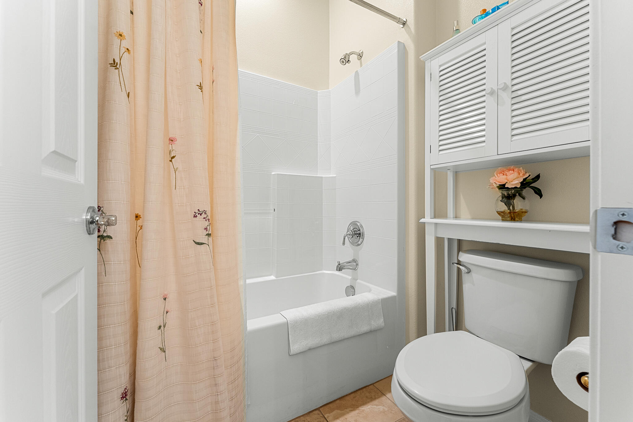 744 Copper Circle Beaumont, CA 92223 - Photo 24 of 44 a white toilet sitting next to a bathroom sink and tub
