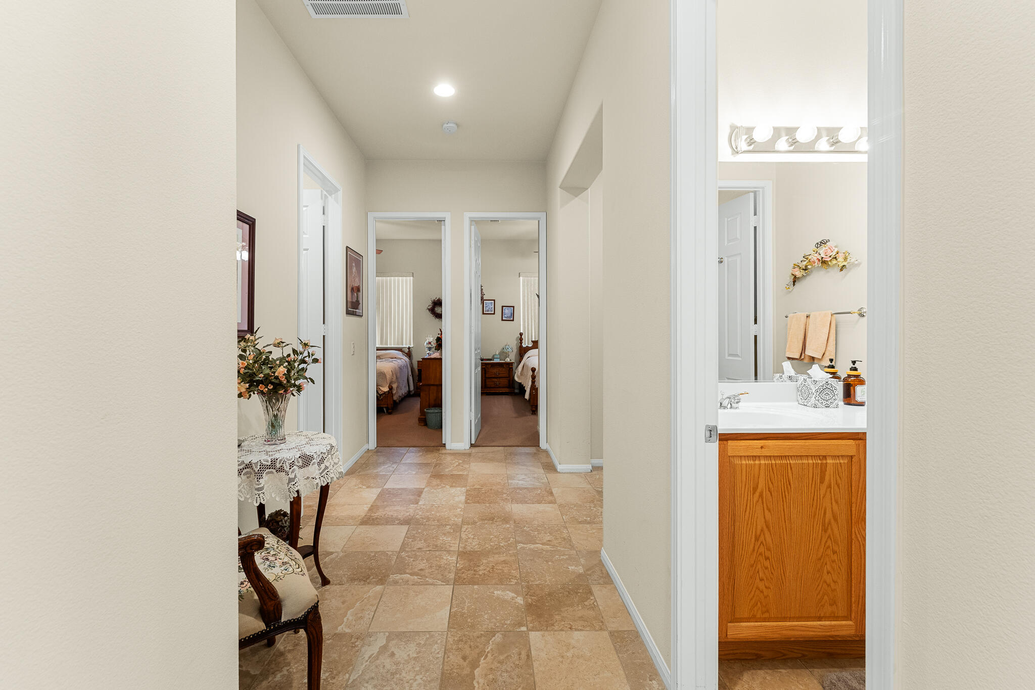 744 Copper Circle Beaumont, CA 92223 - Photo 26 of 44 a view of a hallway with bathroom and shower