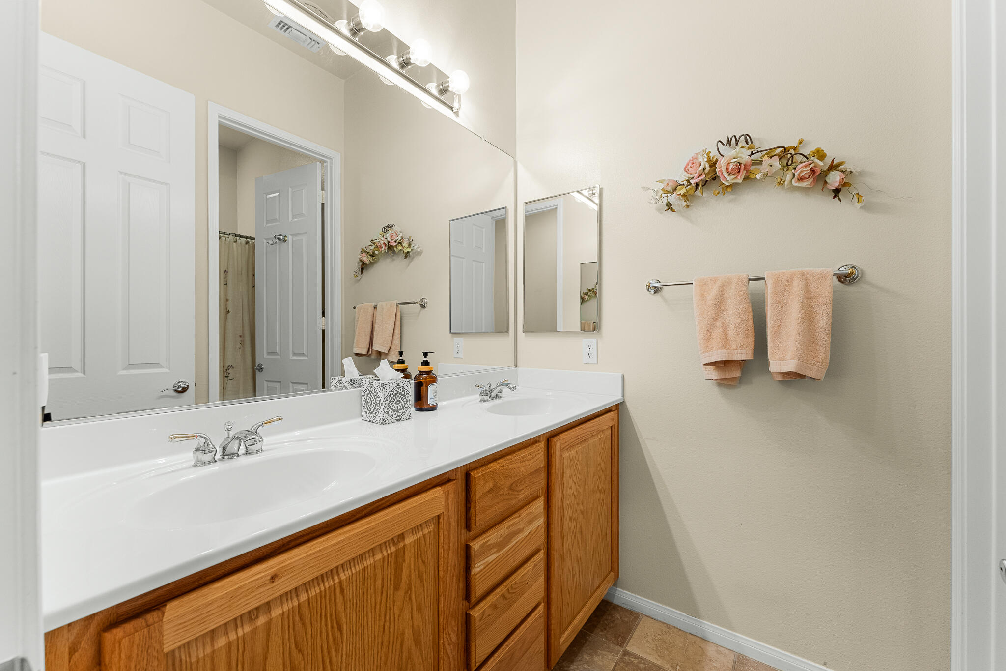 744 Copper Circle Beaumont, CA 92223 - Photo 30 of 44 a bathroom with a sink and mirror