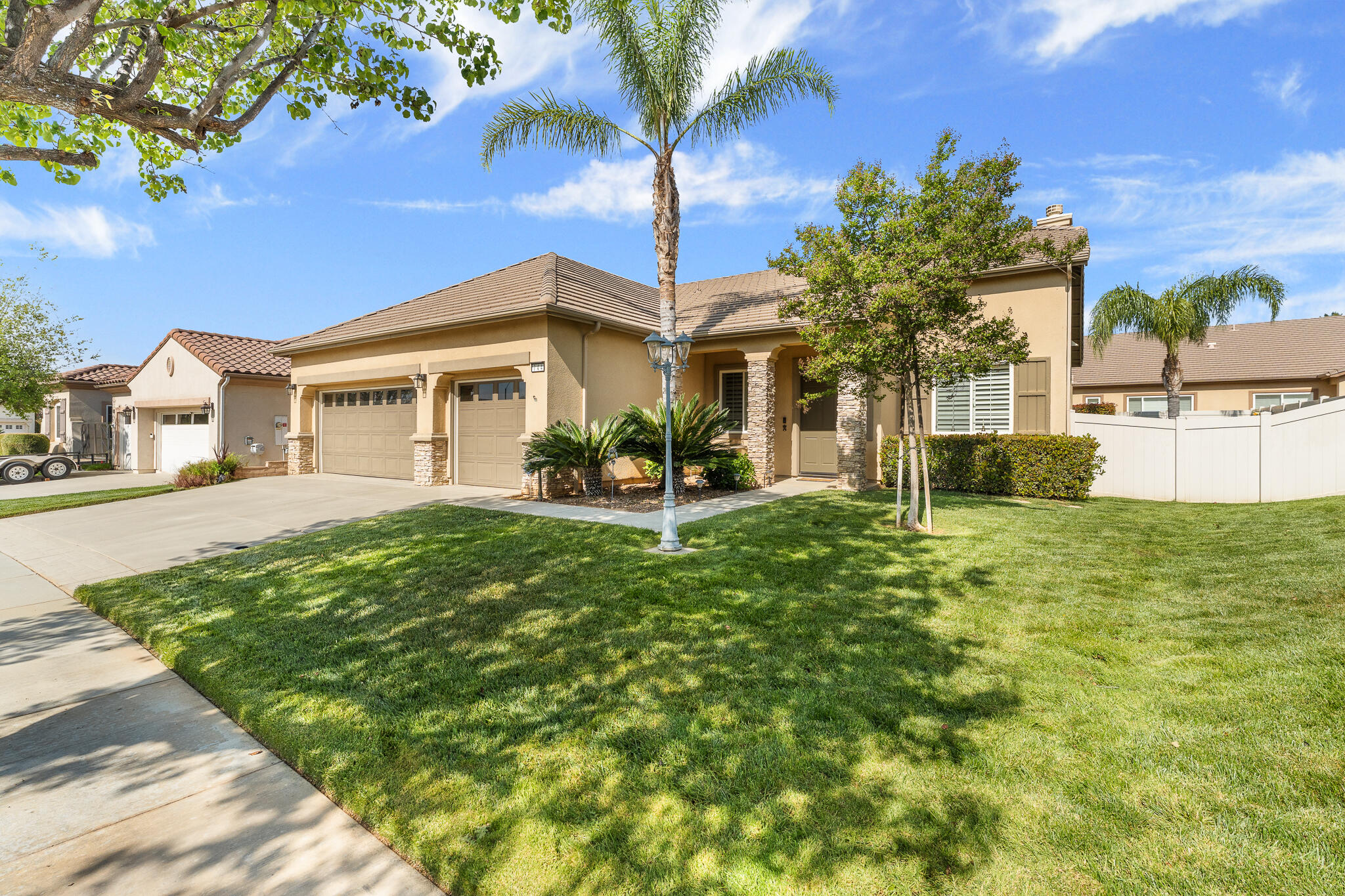 744 Copper Circle Beaumont, CA 92223 - Photo 3 of 44 a front view of a house with garden