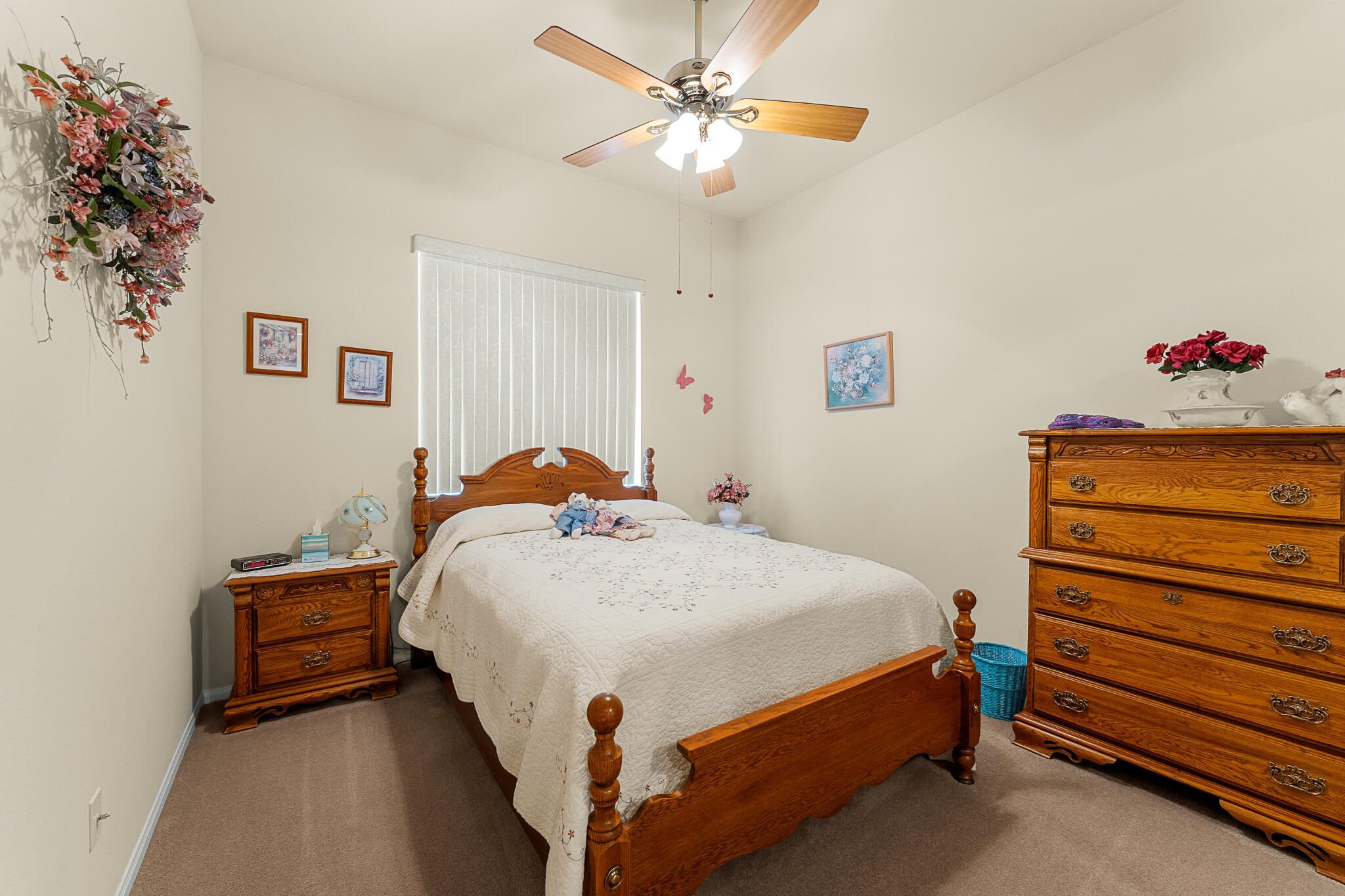 744 Copper Circle Beaumont, CA 92223 - Photo 32 of 44 a bed room with a bed and a chandelier