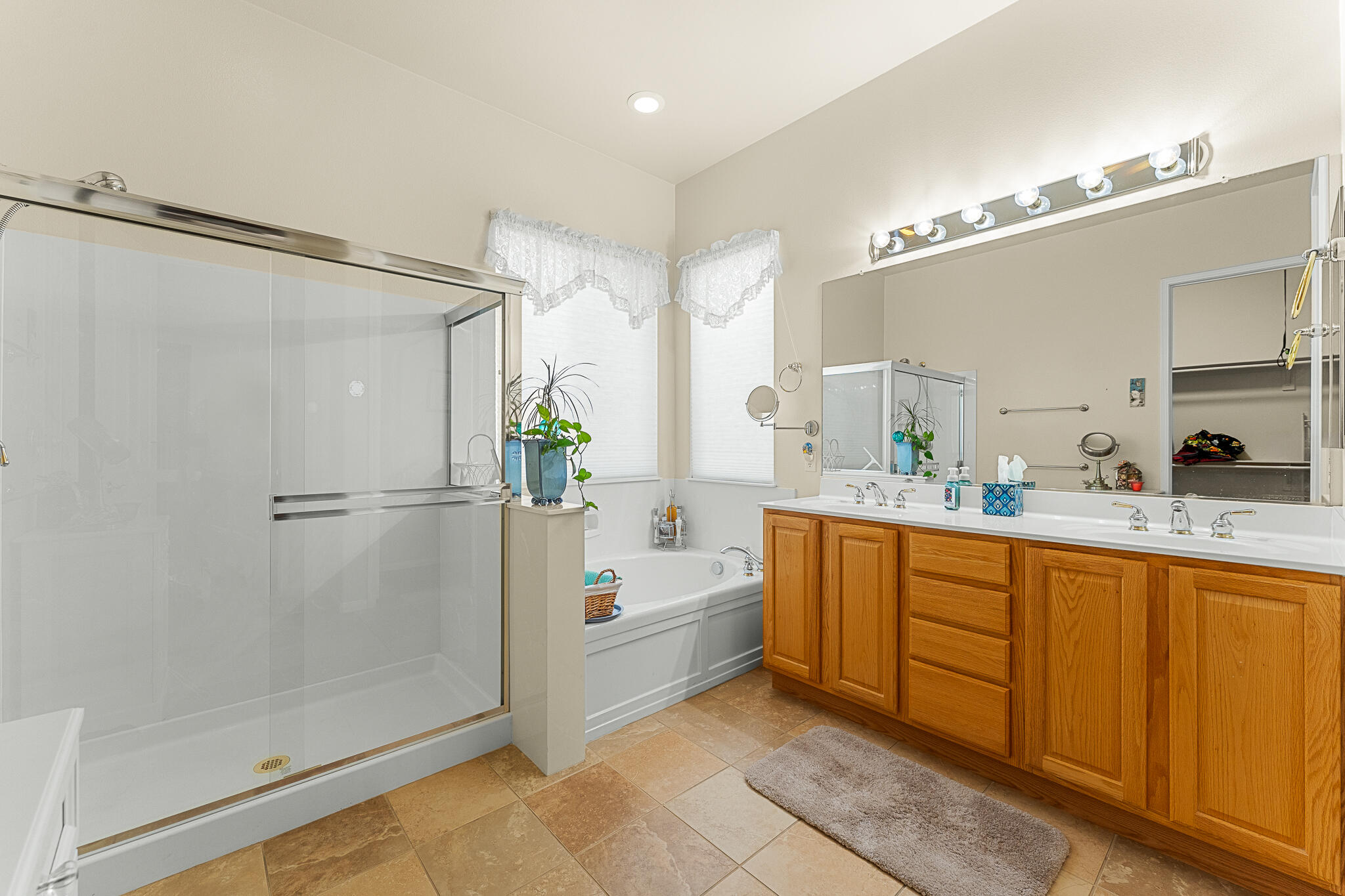 744 Copper Circle Beaumont, CA 92223 - Photo 33 of 44 a bathroom with a tub shower and sink